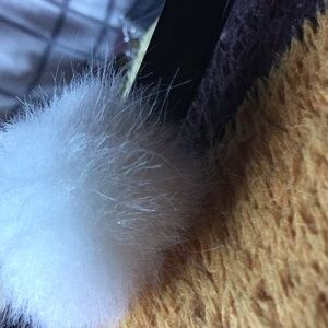 Black choker with white Pom Pom